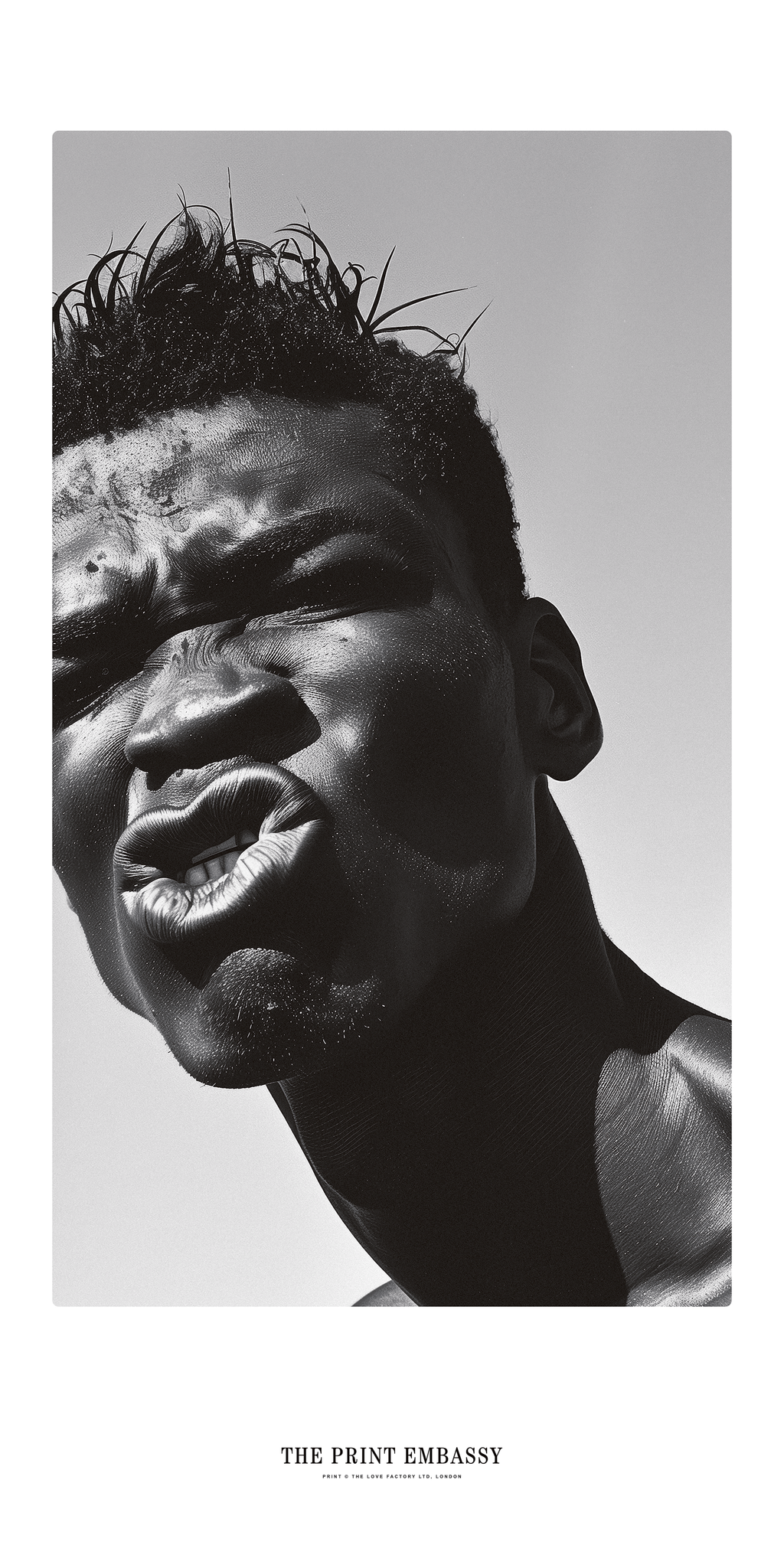 Black and white portrait of a person pulling a funny face against a clear sky. This large wall print is from ThePrintEembassy.com