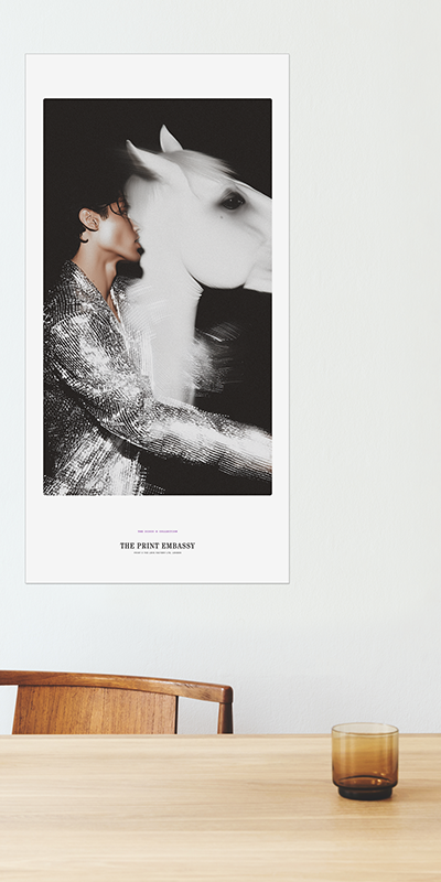 Person in a sparkly outfit standing next to a white horse with a blurred effect, featuring 'The Print Embassy' branding. This oversized print is from their Disco X Collection. 
