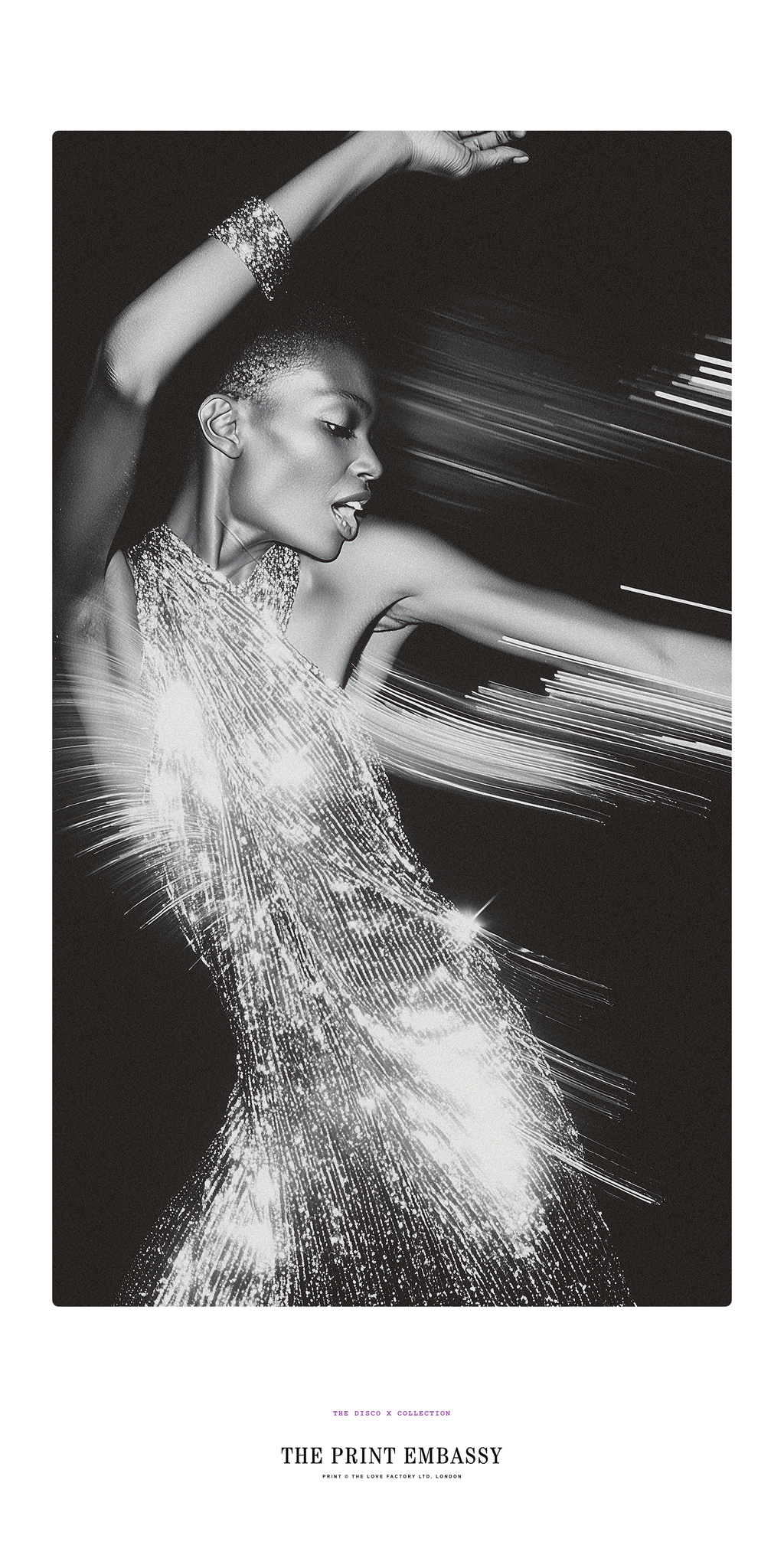 Black and white image of a woman in a sparkling dress with dynamic lines. The giant poster is from The Print Embassy's Disco X Collection. It's a ceelebration of Studio54, music and love.