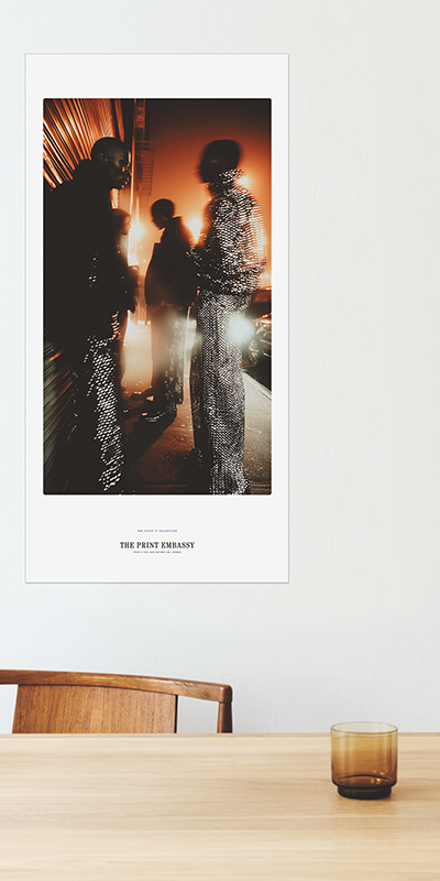 African American guys in fabulous mirror-ball clothing standing on a street at night, illuminated by streetlights. The giant poster is from The Print Embassy's Disco X Collection. It's a celebration of Studio54, music and soul.