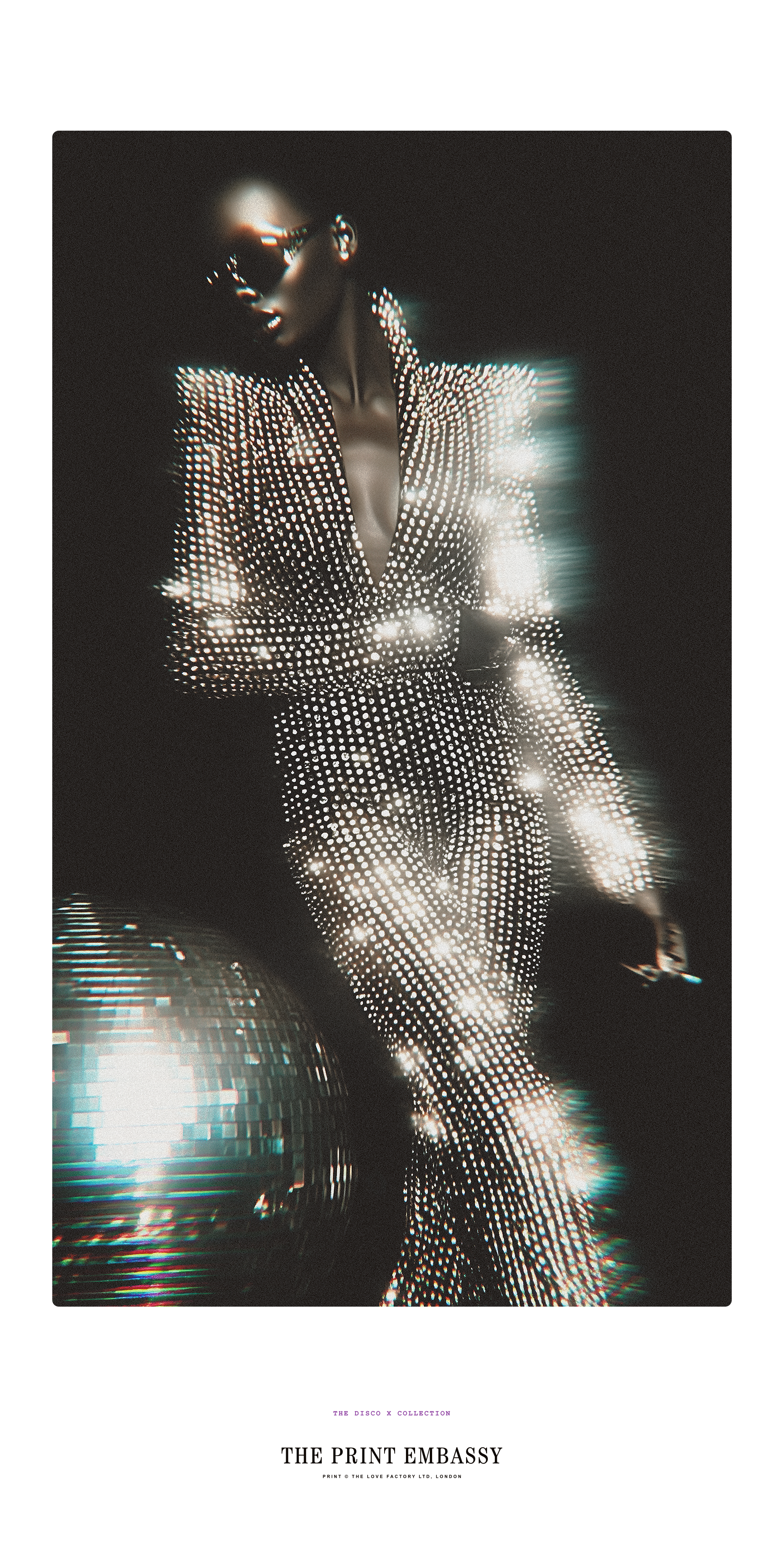 Person wearing a sparkling outfit next to a giant disco ball in the background, featuring 'The Print Embassy' brand. It's from their Disco X oversized print collection.