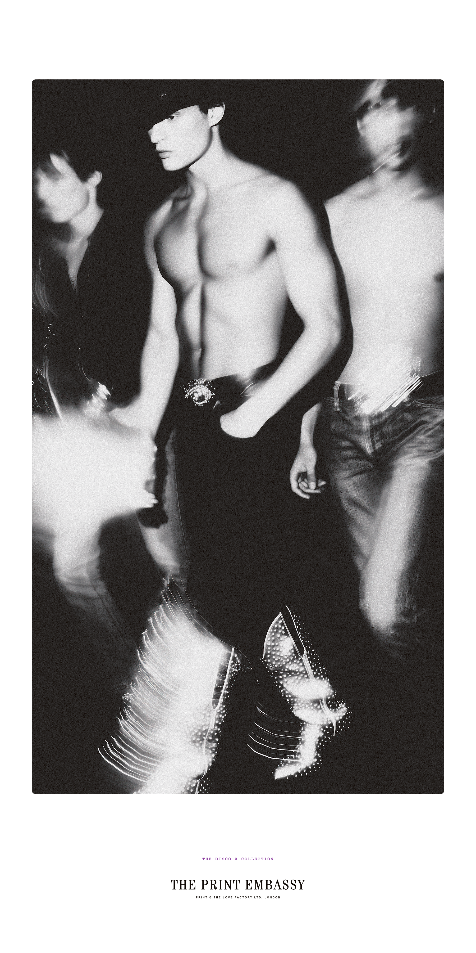 Black and white photo of a handsome shirtless man, circa 1980, wearing sparkly cowboy boots. It features  'The Print Embassy' branding. It is taken from their Disco X Collection.