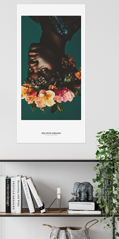 Framed artwork of a person with flowers on a shelf with books and decor.